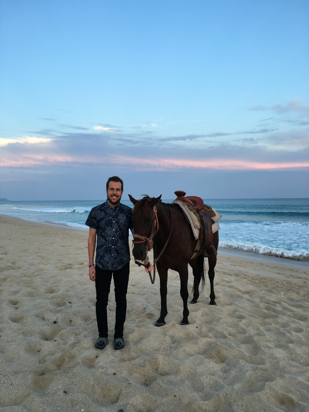 couples romantic horse ride on the beach