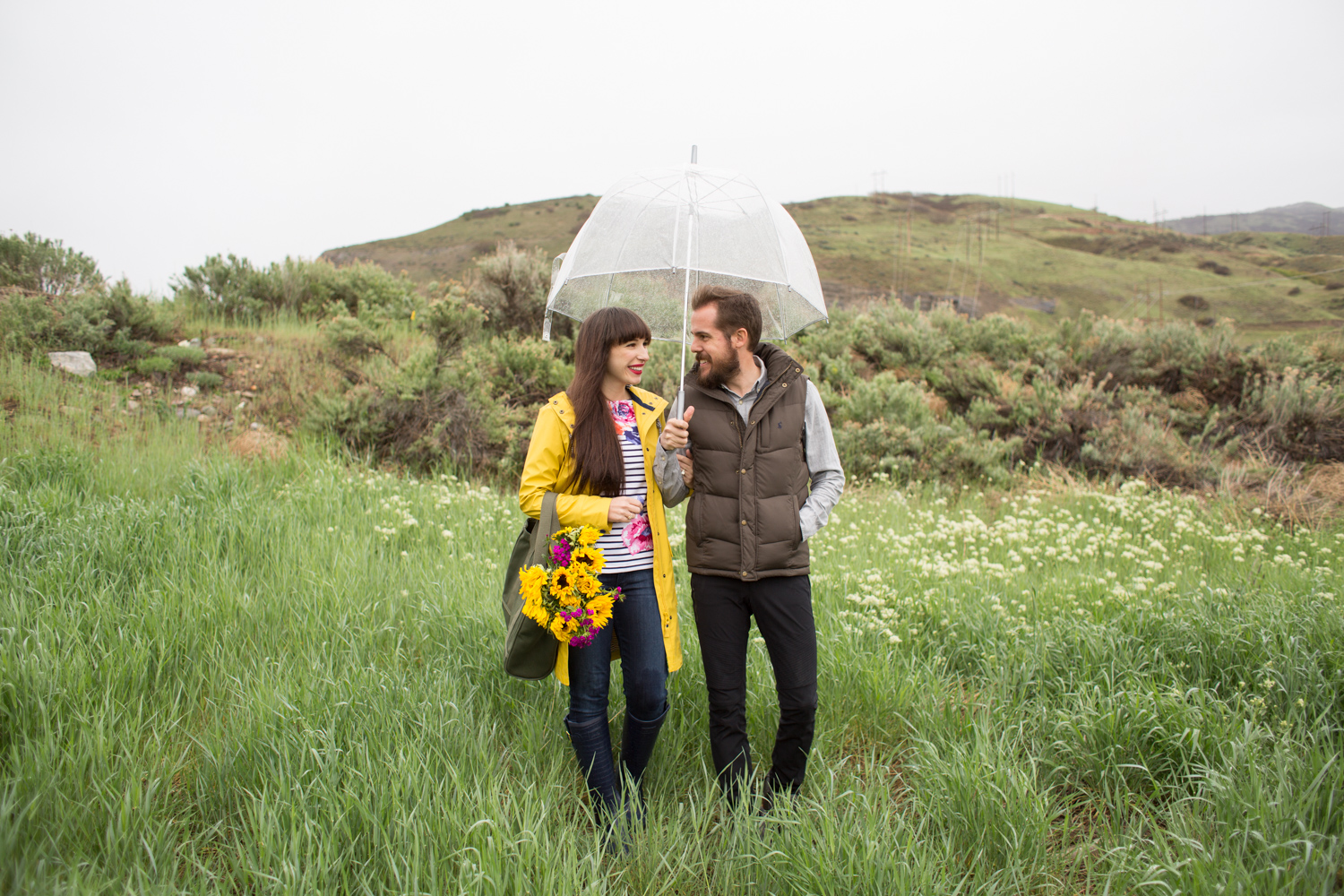 couple in joules clothing rain gear on a rainy day