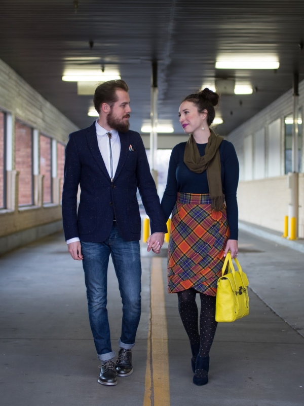 a speckled blazer and a plaid skirt